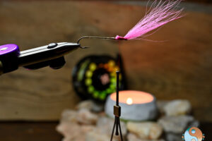 Thunder Creek Minnow - Fluorescent Pink Chartreuse - RoadTrek TV - Trail of Highways - Saltwater on the Fly - _001 copy Next step after the lead head is to tie in the Fluorescent Pink Bucktail for the head and back on Thunder Creek Minnow