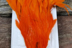 Ewing Hackle Hen Cape Orange 1. 3 Ewing Hackle Orange Hen Cape, Saltwater on the fly.