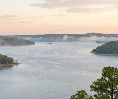 Fly Fishing Bass Beaver Lake Arkansas experience for dedicated anglers seeking trophy fish in deep timber for Premier Bass Fly Fishing