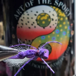 Monster of Purple — a foam-topped slider or twitcher built to float and hunt. Holographic legs, dense bush fur body. Shop it at Saltwater on the Fly.