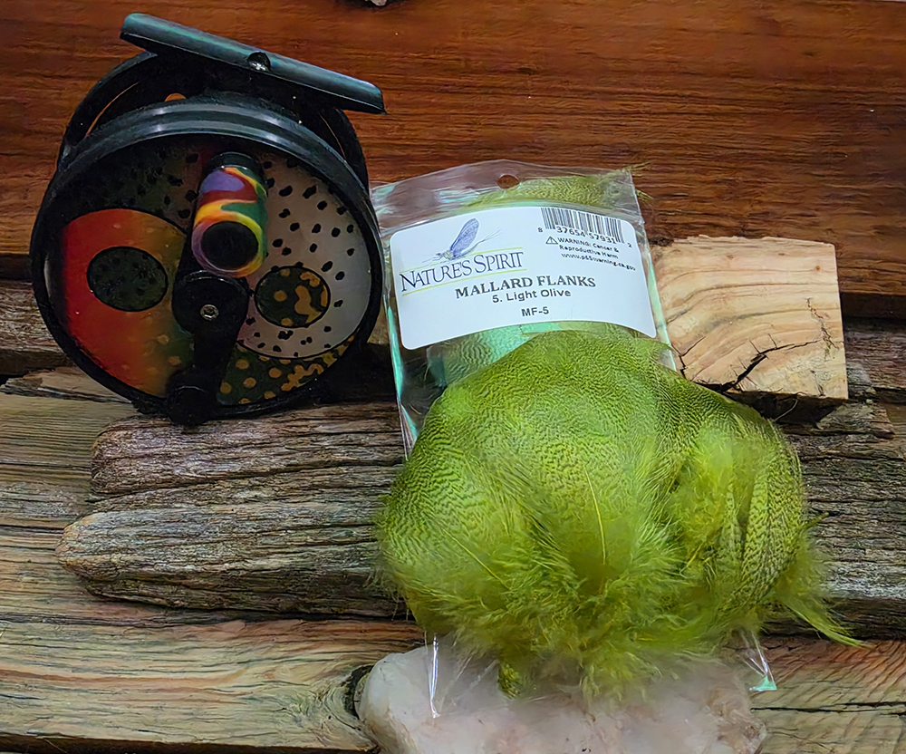 Light olive mallard flank for caddis pupae and bonefish shrimp legs. About 60 hand-sorted feathers per 2g pack, mixed sizes, junk pulled-Saltwater on the Fly.