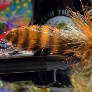 Orange Grizzly Sugar Momma crawfish streamer fly with orange grizzly marabou and olive brown body, Saltwater on the fly.